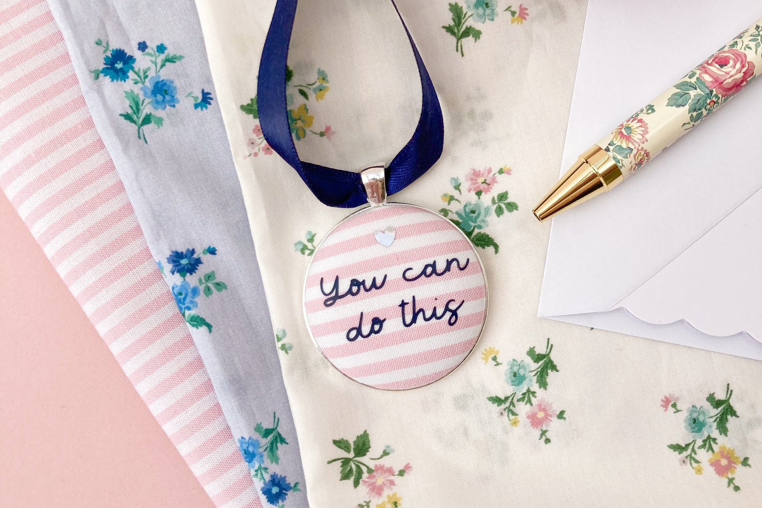 You can do this motivational keepsake with pink and white fabric