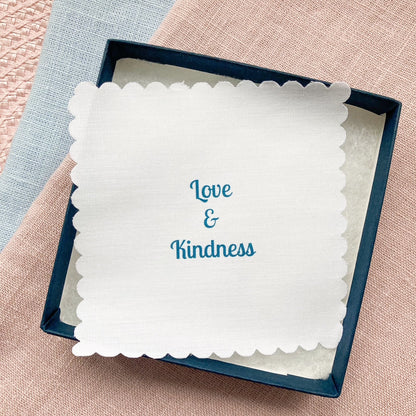 Gift box with a fabric message printed with 'Love & Kindness' text